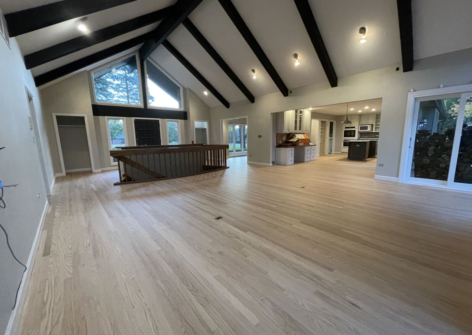 Whole main level of an Inverness home refinished in a natural tone