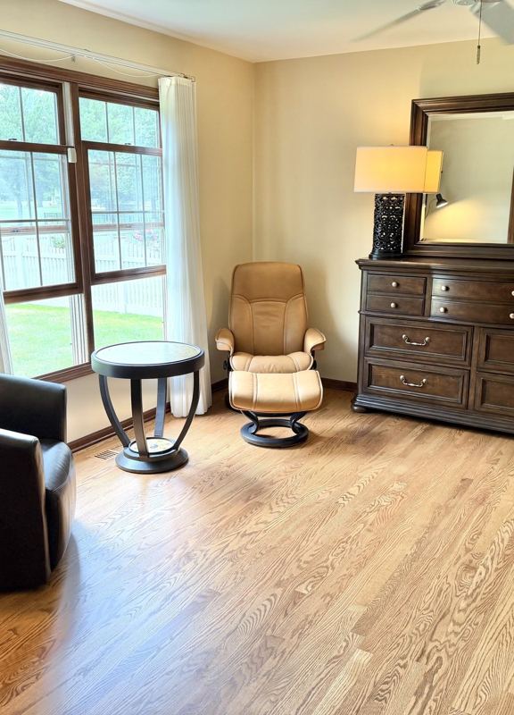New oak hardwood floor installed after carpet removal in Oswego